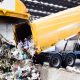 Garbage truck unloading solid waste