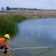 An engineer inspecting the water